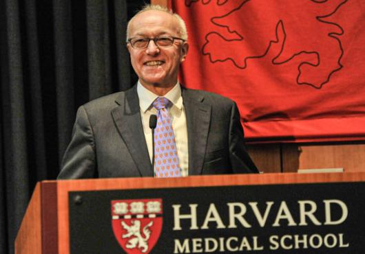 Dean Daley speaking at podium during State of School address 
