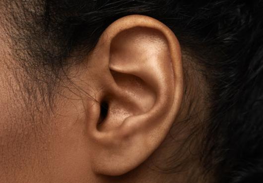 Close up of woman's left ear and cheek 
