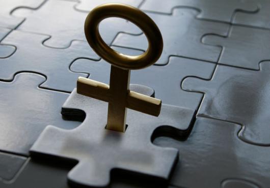 A puzzle piece with a female sign for a handle clicking into a puzzle