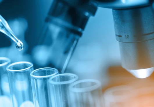 Photo illustration of pipette, test tubes, microscope