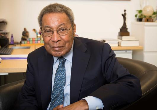 Dr. Alvin Poussaint in his office