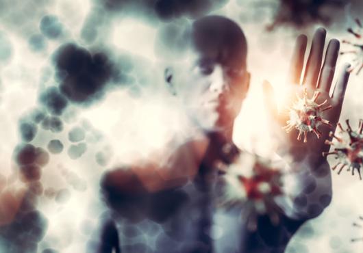 Illustration of a human warding off SARS-CoV2 virus with hand 