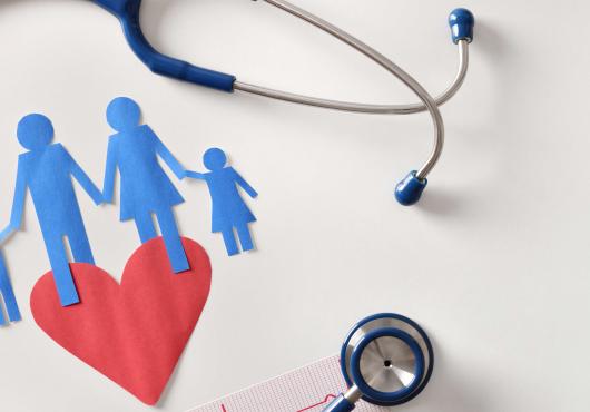 Illustration with stethoscope and paper dolls of family 