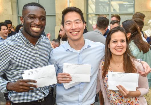 3 HMS students together holding their Match letters 