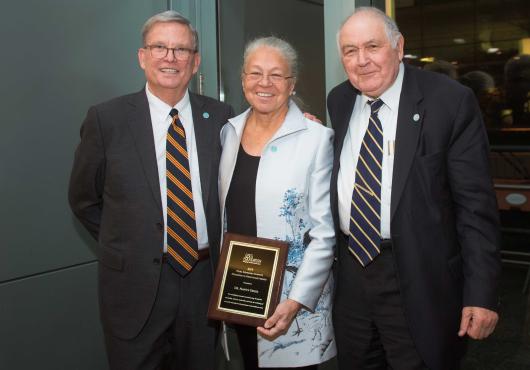 Richard Levin, Nancy Oriol and Ronald Arky displaying the Hurwitz award plaque. 