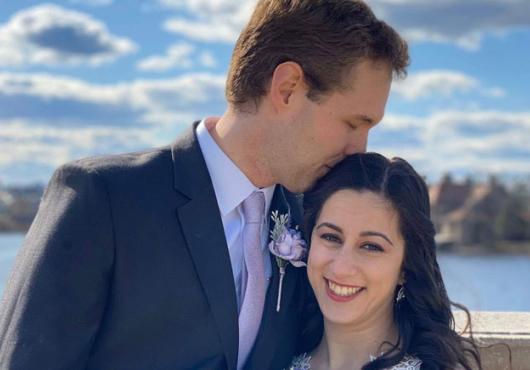 Portrait photo of Ovsak & Fallah in wedding apparel