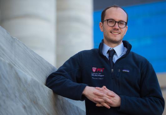 Image of Maury standing on the steps outside Gordon Hall 
