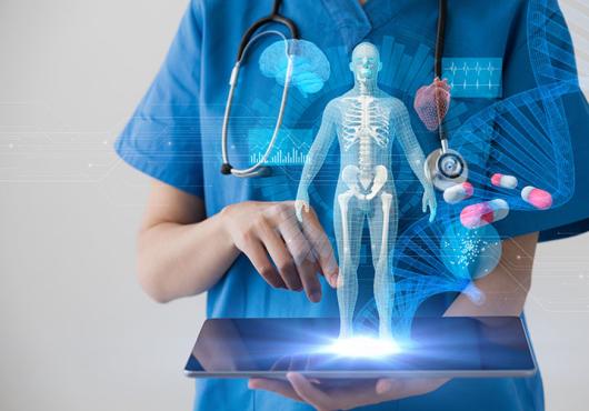 physician holding laptop exploring data
