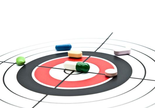 pills on a bull's eye target