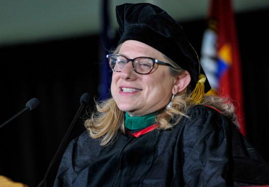Closeup of Brendel in regalia at podium