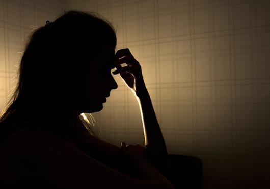 silhouette of stressed young woman