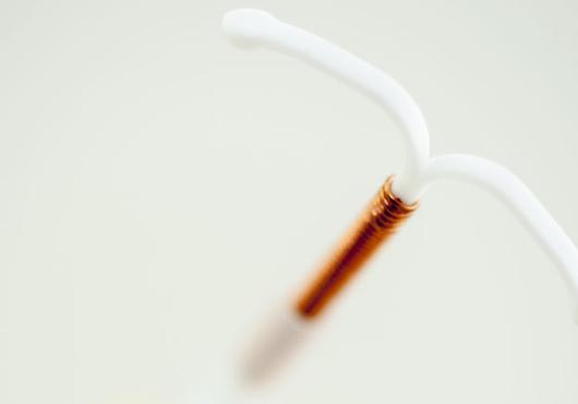 Abstracted close-up of an IUD.