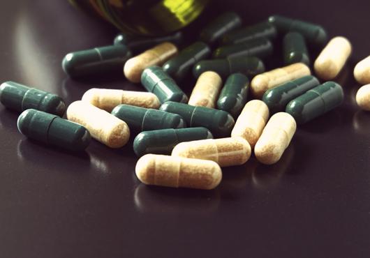 bottle with pills spilling out