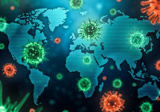Colorful illustration of coronaviruses superimposed over a world map