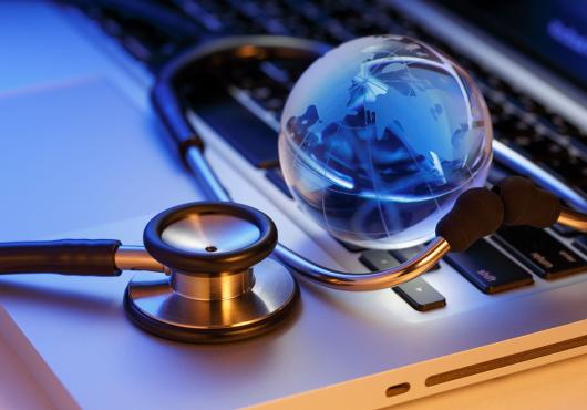 laptop, stethoscope, globe