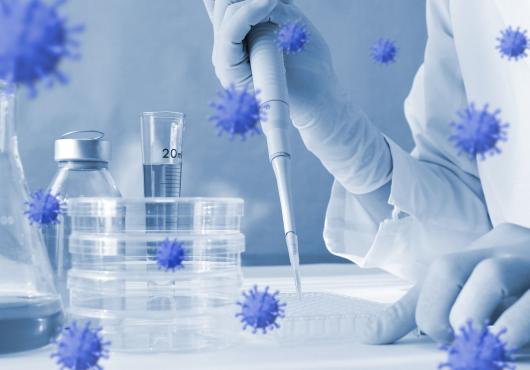 Photoillustration of coronavirus floating around lab equipment with person holding a pipette