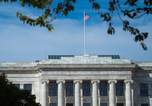 photo of gordon hall facade with flag flying