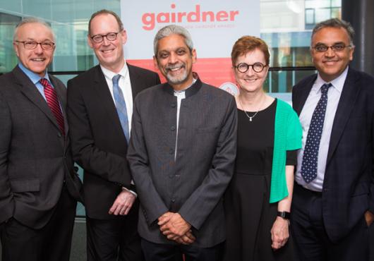 George Daley, Dean of Harvard Medical School, Paul Farmer, head of the HMS department of global health and social medicine, Gairdner Global Health Award winner Vikram Patel, Janet Rossant, president of the Gairdner Foundation and Ashish Jha, faculty director of the Harvard Global Health Initiative celebrate Patel's groundbreaking research in global mental health. 