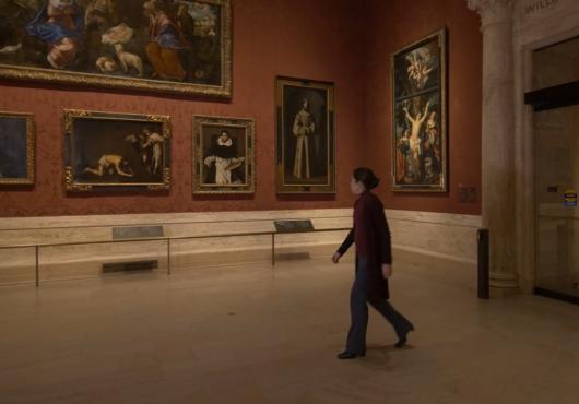 A woman walking in the Museum of Fine Arts