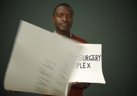 A student holds up signs
