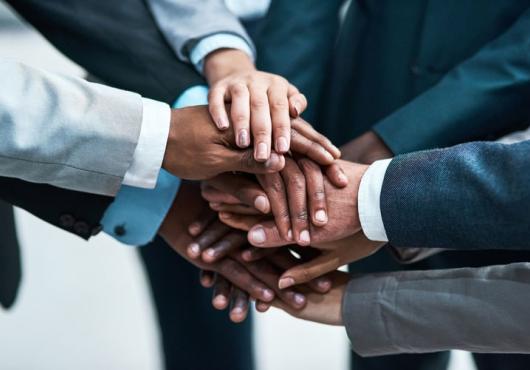 people bring their hands together