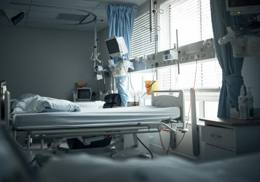 An empty hospital bed.