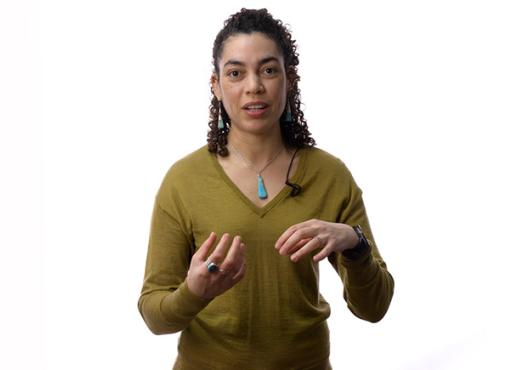 Aleena Garner standing in front of a white background
