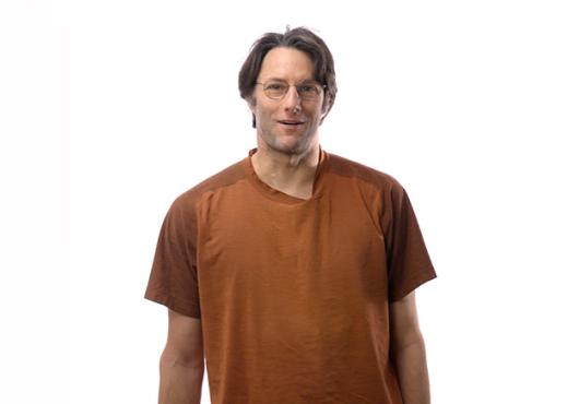 Michael Springer standing in front of a white background