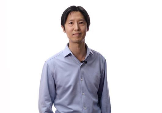 Wesley Wong standing in front of a white background