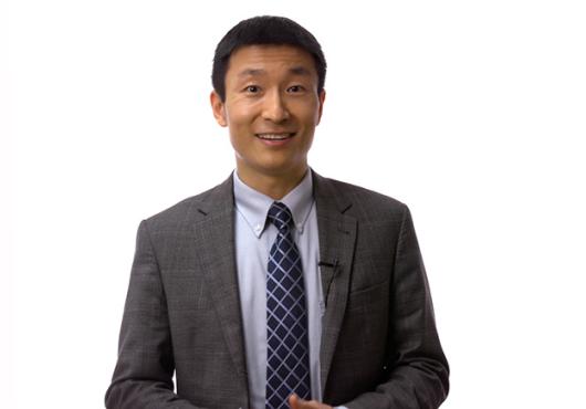 Young Asian man in a suit and tie