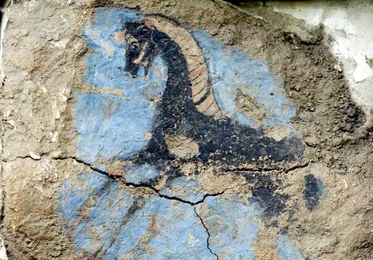 flaking and cracked fresco nonetheless shows a colorful and well-painted image of a horse shown from the side