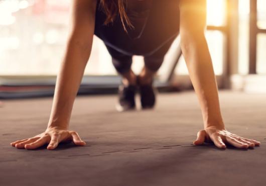 An athlete holding a plank position.