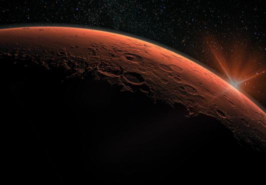 Space photo of Mars with a rising planet behind it
