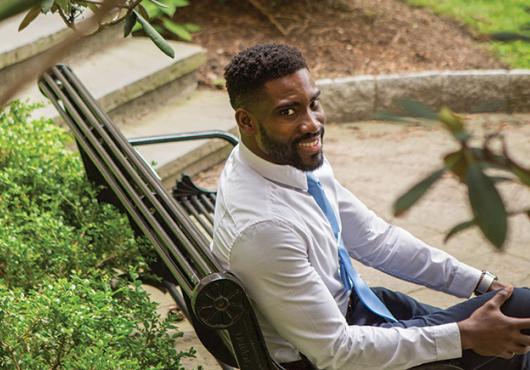 Photo of Nwanaji-Enwerem on a bench in a park