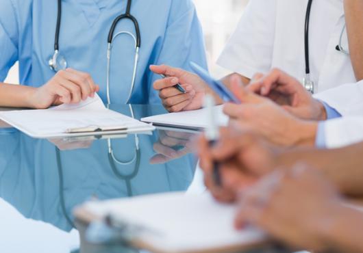 Generic photo of health care workers holding clipboards 