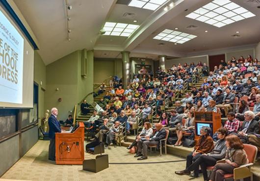 George Q. Daley speaks to an audience. 