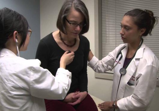 Two doctors check out a patient