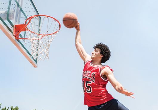 Amen dunking a basketball