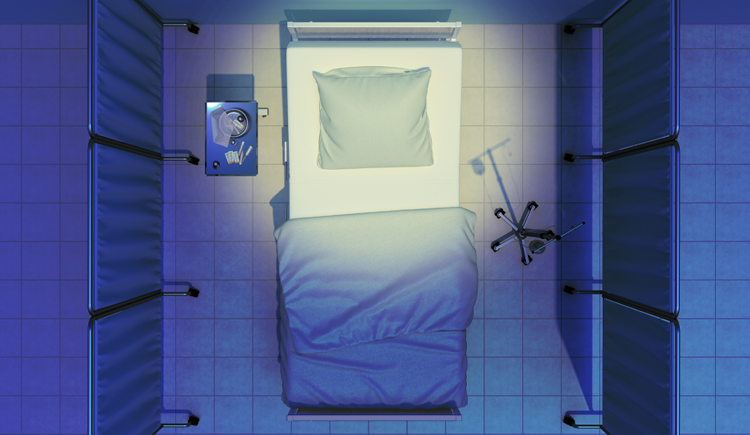 Overhead view of an empty hospital bed with blue sheets, surrounded by privacy screens, with an IV stand on one side and a small table with supplies on the other.