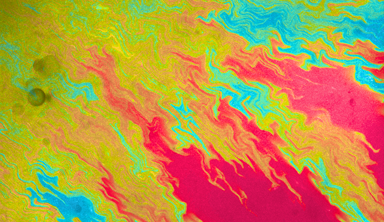 Abstract flows of red, orange, green, and blue