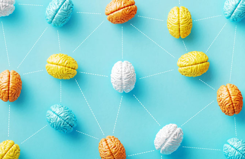 Many multicolored, stylized brains connected by dotted lines