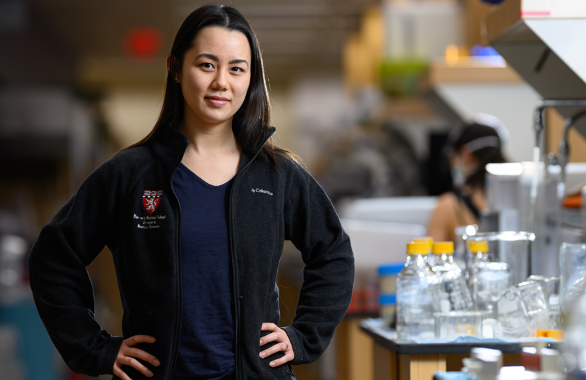 Wong standing in a lab space with her hands on her hips