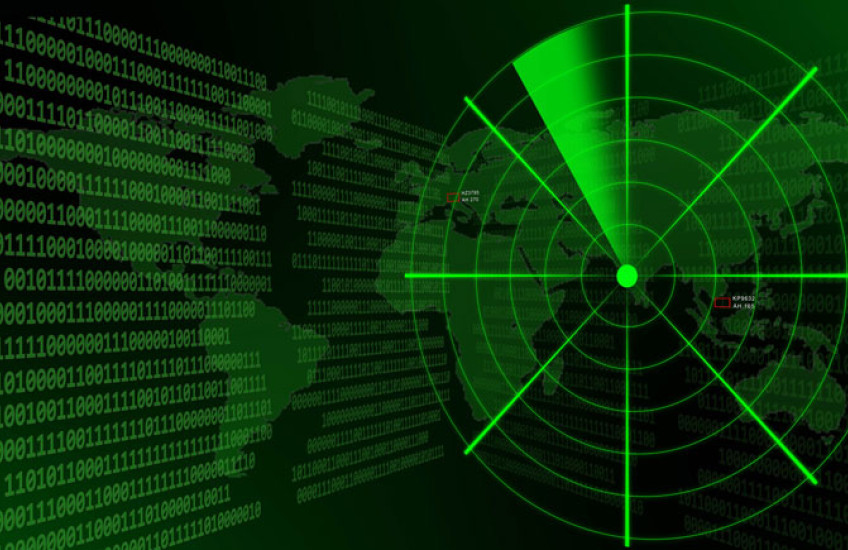 A green and black graphic with a radar target, binary code, and a world map