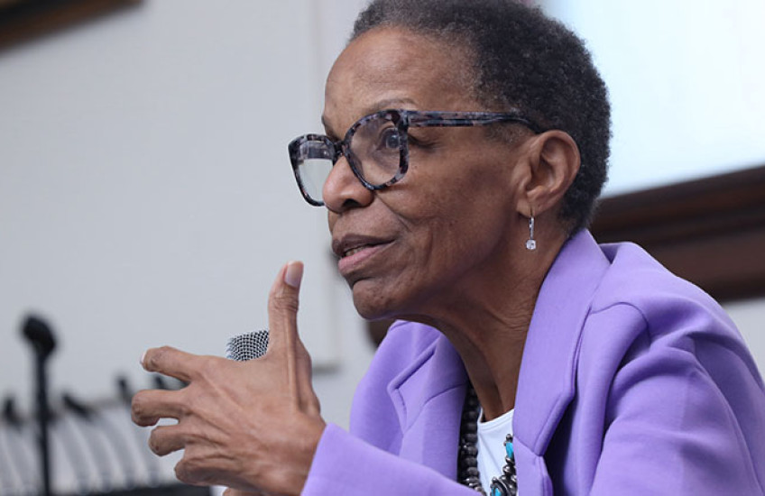 Photo of Joan Reede speaking at a podium