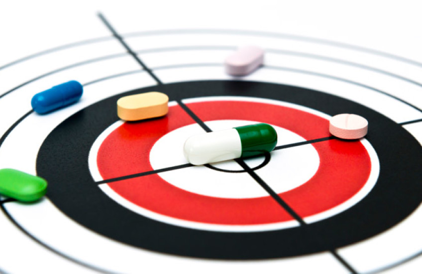 Drawing of a target with pills on lying on top