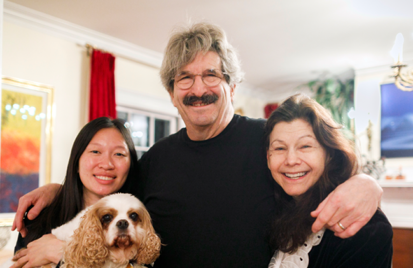 Gary Ruvkun with daughter Victoria Ruvkun (left), dog Barnaby, and wife Natasha Staller the morning of the announcement at their home in Newton.