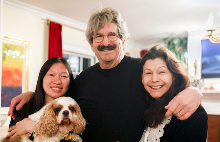 Gary Ruvkun with daughter Victoria Ruvkun (left), dog Barnaby, and wife Natasha Staller the morning of the announcement at their home in Newton.