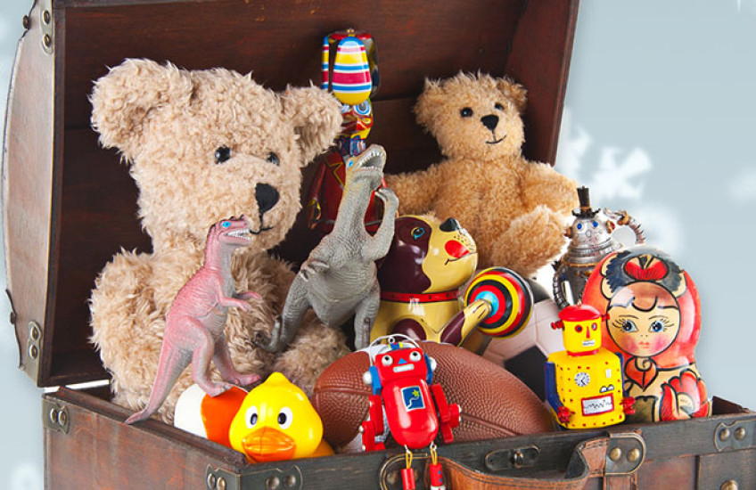 Wooden chest filled with children's toys