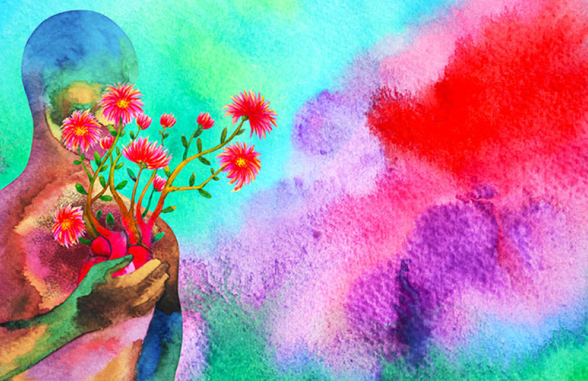 Abstract and colorful representation of a human silhouette holding flowers