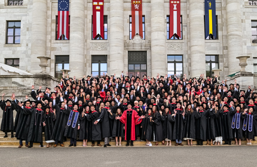 MD and DMD graduates stand on the steps of Gordon Hall.